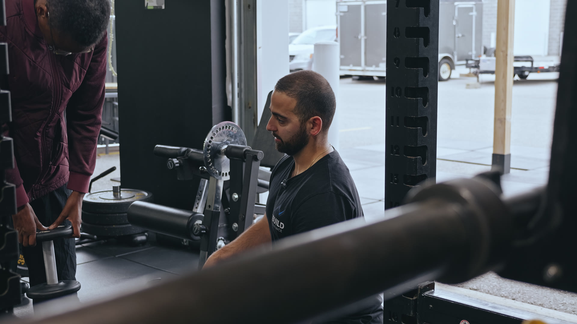 Alex coaching Natasha during their Rebuild Performance workout